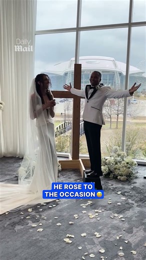 Groom pulls out step stool for first kiss with bride