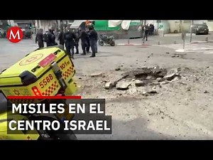 Iranian missiles hit central Israel as Trump threatens oil attacks