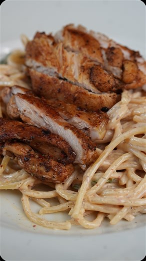 Creamy spaghetti 🍝 with chicken 🍗 INGREDIENTS * Spaghetti 🍝 -75 gms * Chicken boneless thigh-80 gms * Olive oil -10 ml * Chopped garlic 🧄 -8 cloves * Thyme-1 sprig * Salt 🧂 * Crushed pepper * Oregano * Chilli flakes * Fresh cream-60-75 ml * Grated parmesan Cheese 🧀 METHOD * In boiling water add salt and cook the spaghetti 🍝 for 8-10 minutes once boiled add oil to it so it won’t stick together * In a pan heat olive start searing the chicken thigh once half cooked add the crushed garlic wit