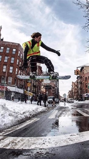 @GNARMADS on Instagram: "Urban Snowboarding in Chinatown, New York City ❄️🏂🍎 • First big snowfall of 2015, with help from friends and a bungee cord slingshot was able to jump over this portion of Canal street (pre-dimes square) • Cover photo by @sdj • @nytimes photo by @hiroko.masuike this flick ended up being printed in newspapers all over the USA and shown globally on international news channels all winter! • Planning some bigger urban gaps this year 🤫 @gnarmads #gnarmads • #snow #nyc #urba