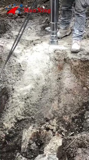 Powerful Hydraulic Rock Splitter Breaking Massive Rocks on Site