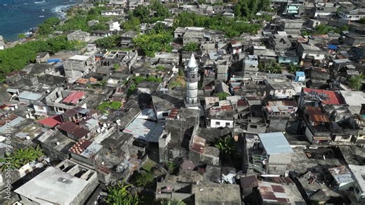 Aerial top down drone reveal scenic picturesque village town of Anjouan volcanic island in the Comoro Islands in the Indian Ocean