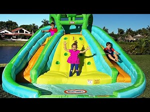 Diana and Roma pretend play with Inflatable water slide