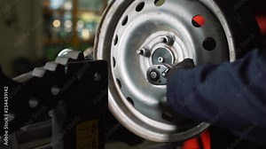 Equipment for car service and repair - tire machine for rolling and alignment of steel wheel rims close-up