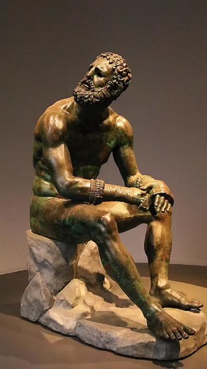 This is your ONE chance to see an ancient boxer up close with your own eyes: This EXTREMELY lifelike statue is called ‘Boxer at Rest’ and is dated to between the 3rd and 1st century BC. Discovered in the ruins of Ancient Rome, it depicts an Ancient Greek boxer in exquisite detail: He has the same cauliflower ear, facial scar tissue, broken nose and functionally muscled build seen in today’s fighters. The figure has ancient boxing gloves known as ‘cestus’ and wears the beard common of ancient fig