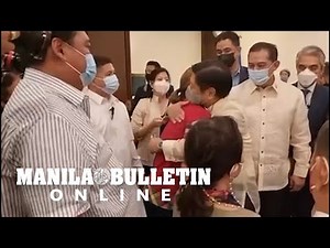 Bongbong Marcos Jr. and Sara Duterte greet each other with a tight embrace before their proclamation