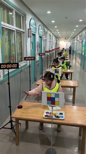 Practising memory skills inside a Chinese kindergarten. Remember the graphics then copy them.