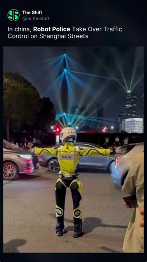 The Shift on Instagram: "Forget humans? 🤖 Robot police were recently spotted directing traffic on the streets of Shanghai during a training exercise. At a busy intersection in the Huangpu District, a humanoid robot performed basic traffic control gestures—signaling cars to stop, go straight, or turn—as part of China’s ongoing experiments with AI-powered traffic management. The robot is still in the research and development phase and hasn’t been officially deployed, but the trial offers a glimps