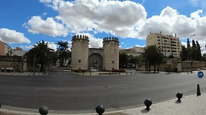 Badajoz, Spain, September 10, 2021: Facade of the Door of Palms (Puerta de Palmas) is a monumental door of an old wall that surrounded Badajoz in the past, it is located beside the Bridge of Palms.