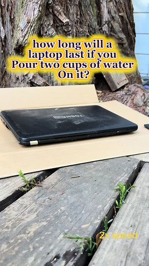 Acer laptop water test: pouring water on a broken laptop