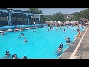 People Take A Dip In Outdoor Pool On Hottest Day