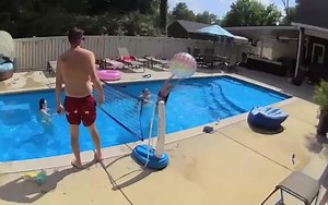 This family was playing a game of pool volleyball when one of them hit the ball out of the water. The man helped hit the ball back into the pool, however, he lost his balance and fell on the patio. Luckily, he seemed okay as he quickly got back on his feet. | Jukin Copyright Management