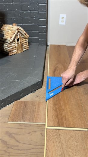 Dmytro K on Instagram: "Flooring install by the fireplace #stairs #remodel #diy #flooring #fyp"