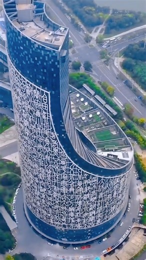 Marvel at the striking design of the "Heavenly Script Building." The Anhui Radio and Television Center in Hefei features a vast seal-script curtain wall displaying more than 370 ancient Chinese characters, each 8 meters tall, resembling an unfurled scroll. Standing 301.7 meters tall, the building stretches 816 meters from east to west, making it one of China's high-rises with the largest horizontal spans. #ChinaTravel #BetterLife #Winter #SpringFestival2026 #SpringFestivalGala2026 #YearOfHorse #