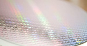 A pattern of microprocessor circuits on a silicon wafer. The semiconductors or central processing unit CPU microchips are fabricated from a silicon wafer with patterned layers of various materials.