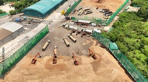 Aerial top view of wood chips with backhoe working load unload chip to truck concept green fuel for save earth. renewable energy from wood Chips