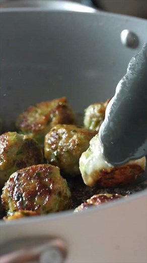 This squishy messy sandwich is so fresh, so yummy, SO GOOD. Love this for dinner so much. Chop in a food processor: 2 cloves garlic 1 serrano pepper, stem removed one 1-inch piece of ginger, peeled a bunch of fresh cilantro Mix with 3 teaspoons fish sauce, 1 1/2 tablespoons brown sugar, 1 tablespoon cornstarch, 1 pound ground chicken and a pinch of salt. Fry your meatballs in a pan with some oil, then make your sandwiches! Naan, mayo, shallot, cucumber, mint, chili crisp, meatballs! ✌️ #meatball