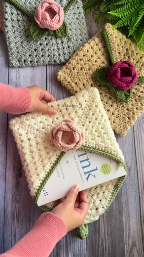 Mushyy | Crochet Patterns & Tutorials on Instagram: "Blossom Crochet Envelope Book Cover Pattern - a cozy , handmade hug for your books with a Rose that will steal everyone’s hearts! This is a beginner friendly, quick to make and a customizable pattern, which can be used to fit any book or device of your choice💕 🧶✨ Grab this and more of my Crochet patterns - available exclusively at my Etsy shop, Mushyy Store! Pattern Designed By - Mushyy (@Mushyy_1) Follow for more Crochet inspo✨ I share begi