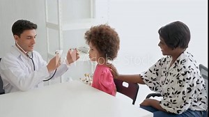 doctor using stethoscope exam chest checkup listening to heart of kid in healthcare hospital .