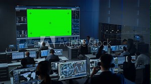 Big Green Screen Horizontal Mock Up in a Mission Control Center Room with Flight Director and Other Controllers Working on Computers. Team of Engineers Work in Monitoring Room Full of Displays.