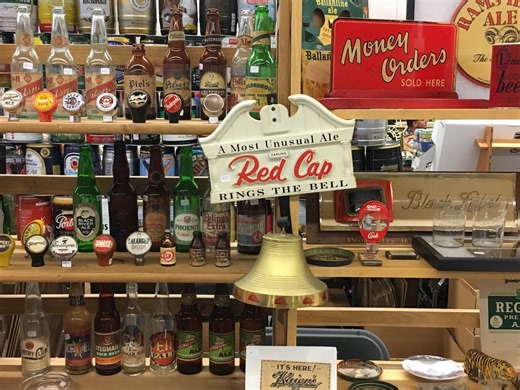 Breweriana collectibles show set, with beer-related items for sale, trade