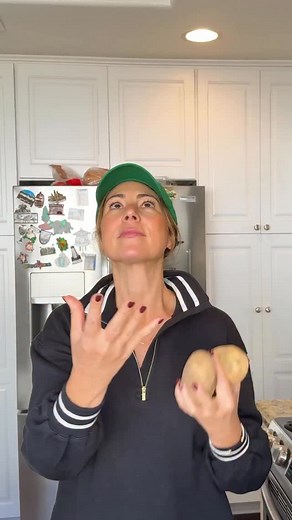 3.6K views · 39 reactions | BIRRIA BAKED POTATO 凜 Baked potato flavor explosion  Here’s what I used: makes 2 loaded potatoes : 2 baked russet potato (air fryer 400°F for 40 mins) rubbed first in olive oil and salt TJ’s beef birria, heated Topped with sour cream, green onion, cilantro Finished with chili crunch | Gina Gibson Cooks | Facebook