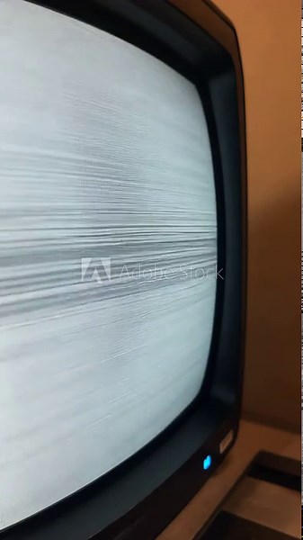 Vintage television displaying static interference pattern, representing technical difficulties, error messages or screen problems in analog broadcast