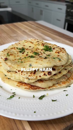 The easiest and fluffiest 4-INGREDIENT NAAN! So simple, delicious, and packs a bit of extra protein into your meal. 👩🏻‍🍳 follow @platedbypadda for more healthy, easy Indian recipes! INGREDIENTS - 1 cup all-purpose flour - 2 tsp baking powder - 3/4 tsp salt - 3/4 cup greek yogurt for garnish: - ghee - 2 cloves of garlic, minced - cilantro, chopped DIRECTIONS 1. Prepare the Dough: Reserve about a tablespoon of flour for dusting. Combine the rest of the flour, baking powder, and salt in a bowl. 