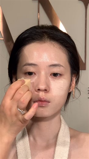 Mina Studio on Instagram: "A natural, dewy makeup look that highlights healthy, luminous skin. Lightweight base with subtle glow on the high points creates a fresh, radiant finish. Soft rosy-brown eyes with gently curled lashes, paired with glossy nude-pink lips, complete a feminine and refined look that appears smooth and radiant on camera, with clear skin detail."