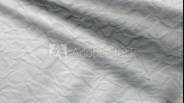 Crinkled white paper texture with soft light creating subtle shadows and highlights showcasing an organic pattern of folds and creases emphasizing a minimalistic aesthetic throughout the shot. Stock Video