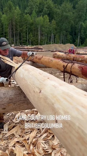 Hand Peeling Western Red Cedar Logs for Log Home Construction
