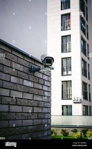 outdoor CCTV camera external video surveillance system. installed on the facade of a residential building Stock Photo - Alamy