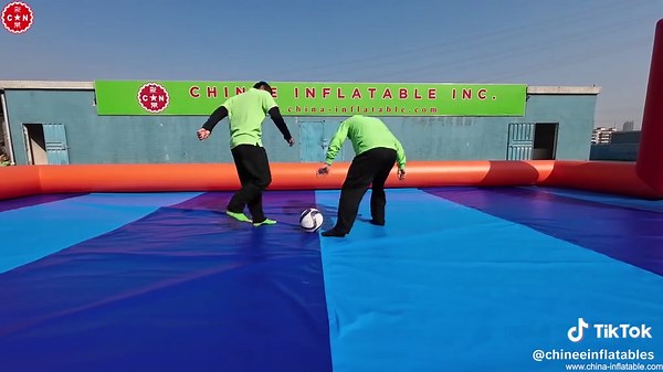 ⚽Inflatable Soccer Field - Bring the Game Anywhere!🏟️🎉 Chinee Inflatables T11-779 Transform any location into a soccer arena with this portable Inflatable Soccer Field! 🌟 Designed with vibrant red and blue tones, complete with goals and a spacious play area, it’s perfect for small-sided games, practice sessions, and fun competitions. ⚽ Suitable for both kids and adults, this inflatable is a fantastic choice for sports events, school activities, or backyard fun. Easy to set up, durable, and an