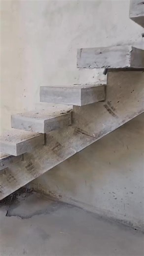 Cantilevered concrete stairs, where structure meets minimalism #DesignSpires #ConstructionDiaries | Designspires Architectural Designs Consultancy