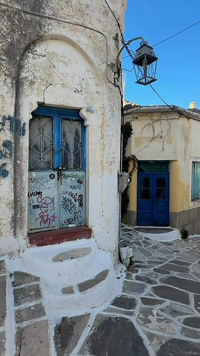 The village that pulls you in ❤️ Lefkes – Paros Island I walked through Lefkes and every corner felt like a small secret waiting to be noticed. The colours hit first. The red and mint chairs, the old turquoise doors, the white steps dressed in flower pots, the yellow facades glowing in the afternoon light. Even the stone paths felt alive with history. I kept moving slowly, turning corners, looking up, looking down, feeling how this village blends charm with character in a way that never feels st