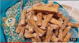 Trini Kurma Makes 220 pieces 2 cups all purpose flour 1/4 cup instant powder milk 1 tbsp. ginger 1 tsp elychee / cardamom 1/4 tsp cinnamon 1/4 tsp nutmeg 2tbsp condensed milk 2 oz / 4tbsp butter unsalted 1 cup water to knead - use only as you need. 2 cups oil for frying ------- 1/2 cup sugar 1/4 cup water | Trini cooking with Natasha