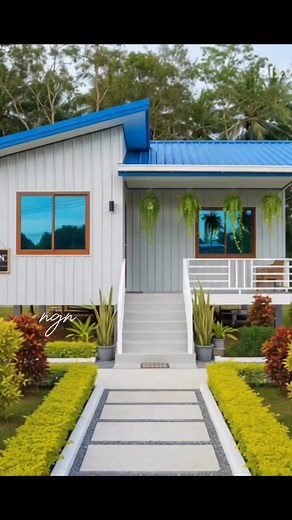 1K reactions · 67 shares | A stunning blend of modern design and countryside charm this elevated blue and white home, built with durable metal cladding, stands gracefully amidst the serene beauty of nature. A perfect sanctuary where clean lines meet peaceful living. #reels #peacefullife #Amazing #Philippines #Nature #construction #dreamhome #housegoals #HouseAndLot | Nathaniel Guevarra Navarro | Facebook