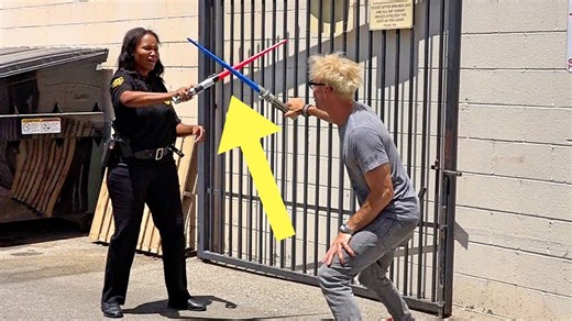 Magician fights with lightsaber on female security guard prank