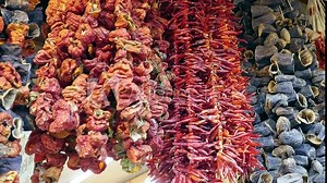 Dried stuffed eggplants and peppers are sold strung on strings,