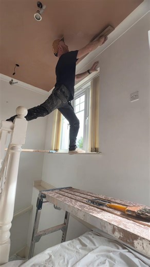 Getting too old for this stretching over stairs and performing a balancing acting on a scafold plank 🤣 one day ill get a big win the lotto but until then it’s the same shit, different day #plastering #ceilings #longwaydown #plasterer #bigwinner