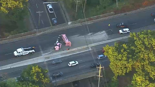 Dump truck full of gravel overturns in Clifton creating traffic mess