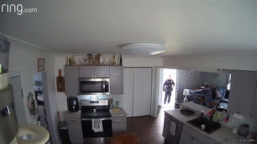 Pup pushes door open, confusing neighbors and police