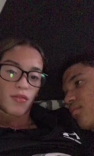 Cozy Moments: Couple Relaxing in Dim Light