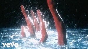 The official music video for 'Twisting By The Pool'. Directed by Peter Sinclair, the song was part of Dire Straits’ live sets as early as 1979, when the New Musical Express name-checked it in a review of the band’s gig at Whitla Hall, Belfast. | Dire Straits