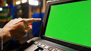 Man's finger pushing buttons on a touchscreen on a voting machine during a USA election where the screen is a chroma key green screen. Stock Video