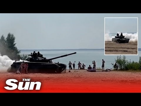 Terrifying moment Russian tank storms across tourist-packed beach sending sun-seekers fleeing