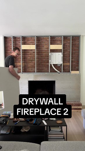Drywalling over our brick fireplace, part 2! Full video up on Youtube, link in bio! #brickfireplace #fireplacemakeover #drywall