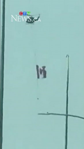 Helicopter flies Canadian flag over Edmonton