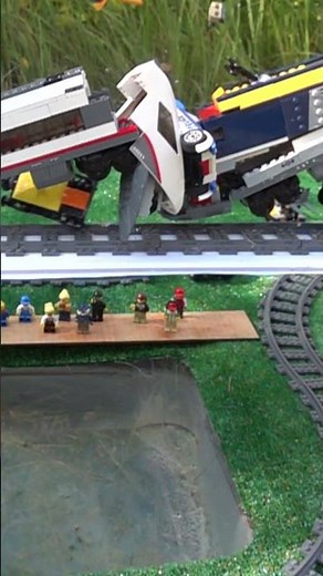 Two Lego Trains Crash and Fall off a Bridge - Slow Motion