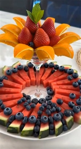Effortless Tiered Fruit Platter: Your Go-To Summer Centerpiece! Struggling to make fruit platters look gorgeous without hours of effort? 🤔 What if I told you there's a simple secret to a stunning, two-tiered fruit display that will WOW everyone? Forget complicated carving or endless prep! This show-stopping tiered fruit platter is unbelievably easy to assemble and perfect for any gathering, from backyard BBQs to elegant brunches. We're talking fresh, vibrant fruits like juicy watermelon, sweet 